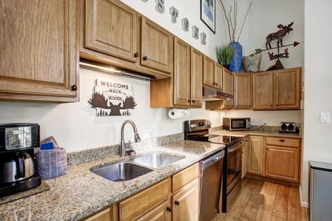 Granite countertops, dishwasher, and modern appliances for easy meals.