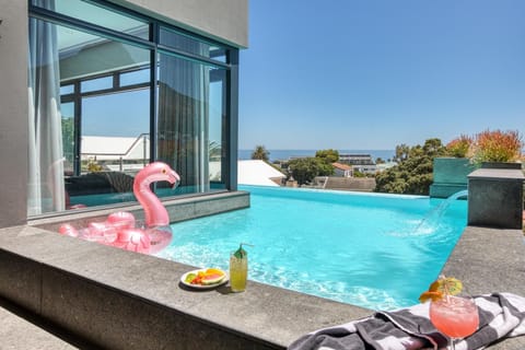 Outdoor pool, an infinity pool, sun loungers