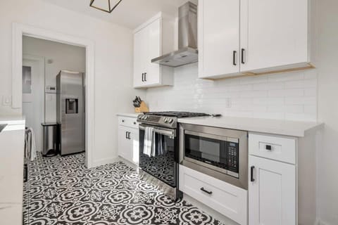 Newly renovated kitchen with stainless steel appliances - includes built in microwave for guest use