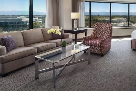 Lounge together by sun-filled windows on a plush sofa.