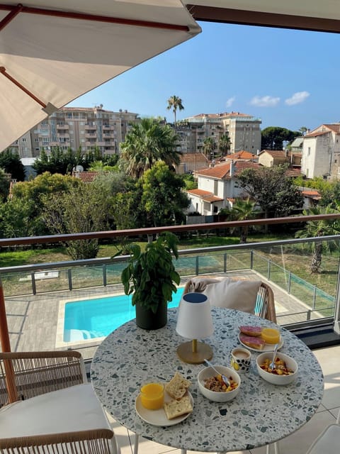 The balcony with the pool in the background