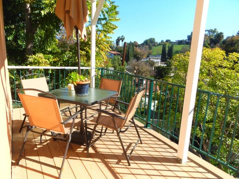 Left Side of Patio with Table and Chairs for 4 plus Umbrella, overlooks hills