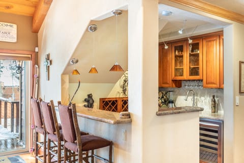 Cozy corner bar in the living room is the perfect place to grab a drink.