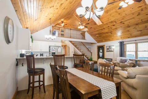 The dining table, the kitchen and the living room; your comfort and relaxation in one photo.