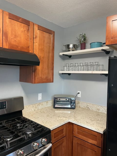 Granite counters wipe clean and open shelving makes finding things so easy!