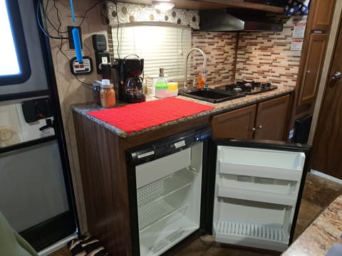 Fridge, microwave, stovetop, coffee/tea maker