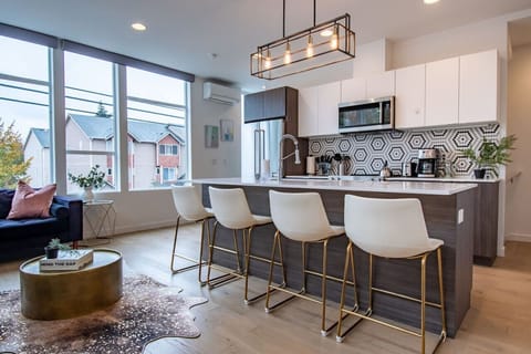 Enjoy large windows in main living space for natural light. Open layout to enjoy both kitchen and living space.