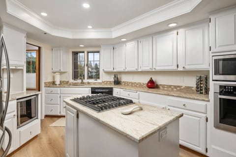 The kitchen is spacious and efficient. Perfect place to prepare a family meal.