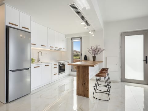 A fully equipped kitchen awaits to unfold your culinary skills.