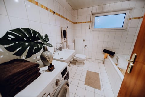 Combined shower/tub, hair dryer, towels, soap