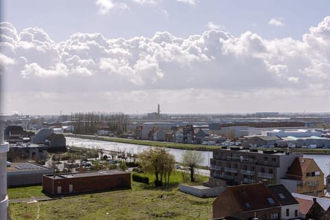 Rolling clouds, city below — open views for miles.