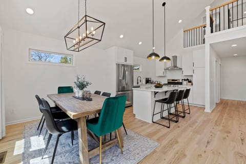 Experience the perfect blend of rustic charm and contemporary style with this farmhouse-modern dining table. With seating for 8 at the table and 3 more at the counter, it's the ideal space to gather and enjoy delicious meals with family and friends.