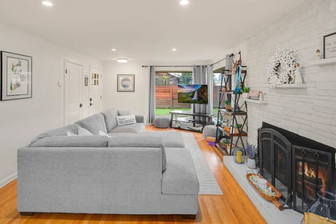 Oversized gray sectional and cozy textures meet peaceful views from the large picture windows