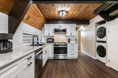 The chef in your group will enjoy preparing a meal in the modern all-white kitchen that is fully equipped with everything you need to prepare a tasty meal.