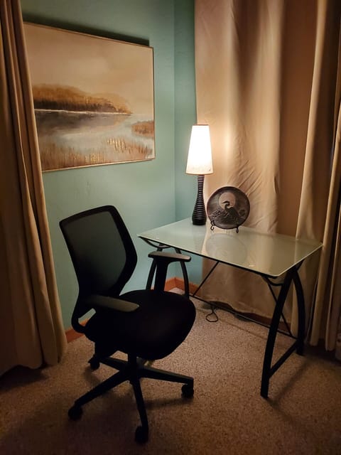 Master - small work desk overlooking lake, deck and hot tub.