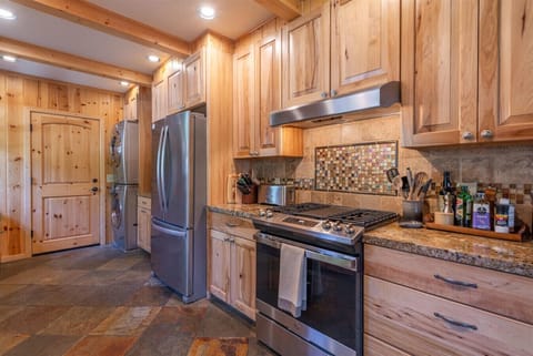 Well appointed kitchen with granite counter tops and stainless steel appliances.