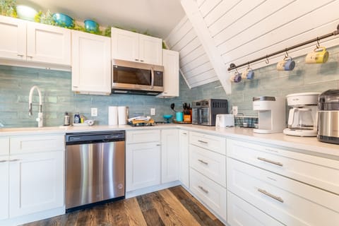 Featuring a dishwasher, microwave, two burner stove top, air fryer/toaster oven.