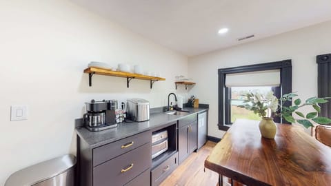 Living Room: The kitchenette comes with a mini fridge, microwave, sink, and some basic kitchen supplies.