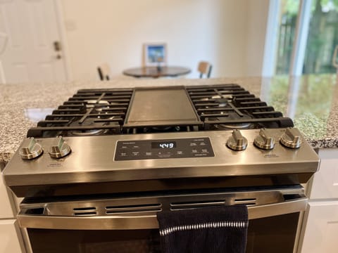 Brand new gas range with 5 burners and a griddle