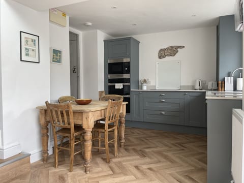 Kitchen - Double oven, induction hob, microwave. Breakfast table