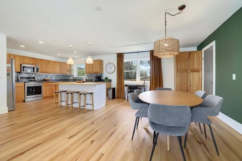 Past the living room, you'll see our oval, 6-top dining table.