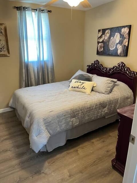 Queen size bed with fan.