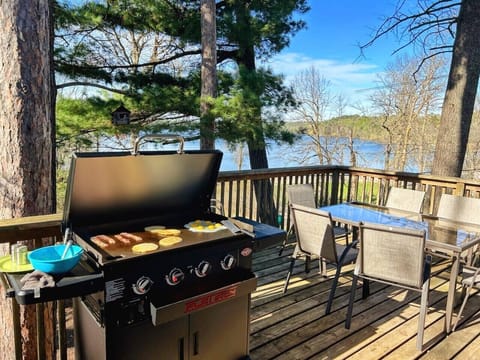 Spacious deck with flat-iron grill and view of Lake May.