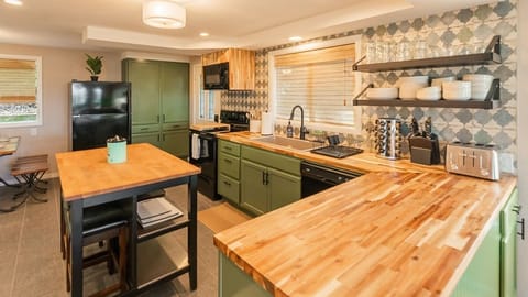 Kitchen with butcher block countertops and island