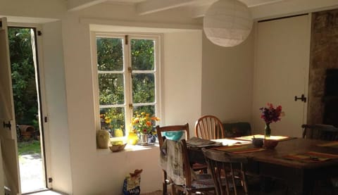 Kitchen with door to walled garden, mostly paved