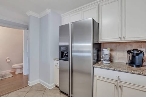 Fridge, stovetop, dishwasher, coffee/tea maker