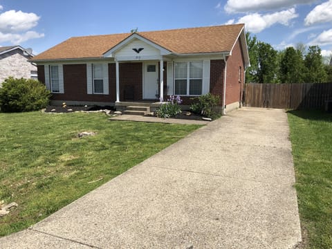 Front of house with driveway.