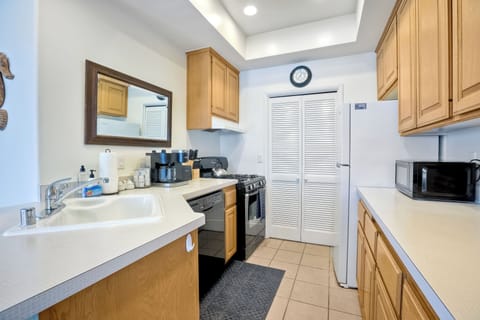 Galley kitchen equipped with all necessary cooking appliances