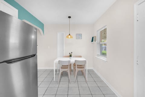 Dining table provides a cozy setting for your meals and can comfortably accommodate up to four people.