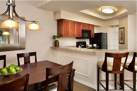 Fully equipped kitchen and spacious dining area.