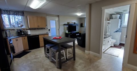 Bright Eat-In Kitchen, Living Room & 3pc Bathroom with laundry.