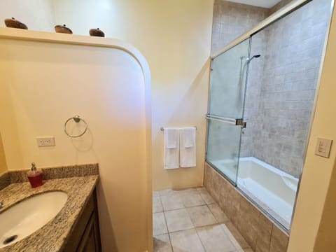 Combined shower/tub, hair dryer, towels, soap