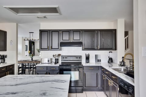 Fully equipped kitchen includes appliances, cookware, glassware, silverware, etc