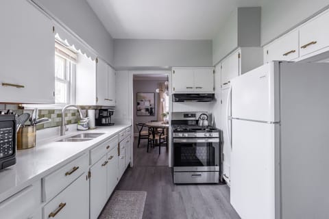 A beautiful renovated kitchen with granite countertops.