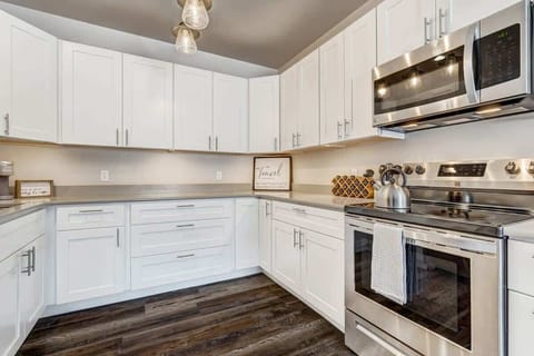 Step into our well-appointed kitchen, where culinary delights await. Every inch is thoughtfully designed, boasting top-of-the-line appliances, ample counter space, and a complete range of cookware. The pantry is stocked with essentials, ensuring you have everything you need to whip up a gourmet meal. From morning coffee to elaborate dinners, this kitchen is a canvas for your culinary creativity.