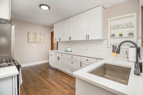 Cook meals in the newly updated kitchen. Kitchen includes nearly any basic cookware you would need: pots & pans, utensils, plates/bowls/cups, hand mixer, blender, mixing bowls, can opener, knives & cutting board, baking tins, glass casserole dishes.