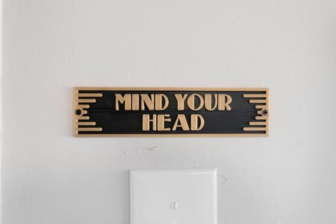 'Mind Your Head' in the lower part of the laundry room
