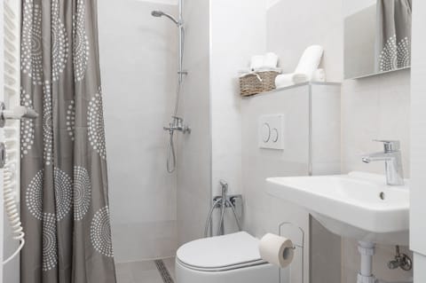 Bathroom with shower, toilet and sink