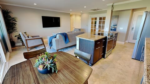 Open kitchen space with modern, updated appliances and elegant granite countertops.