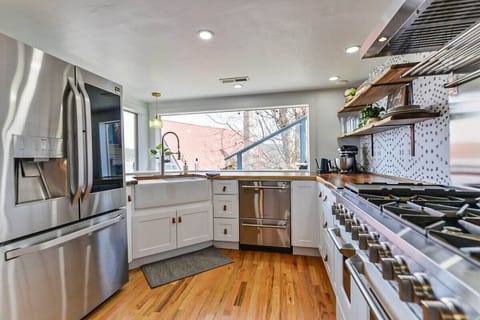 Kitchen with all stainless appliance. Dual ovens with 8 burners. Farm house sink, butcher block countertops and so much more!