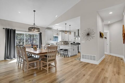 Another view of the dining area and kitchen