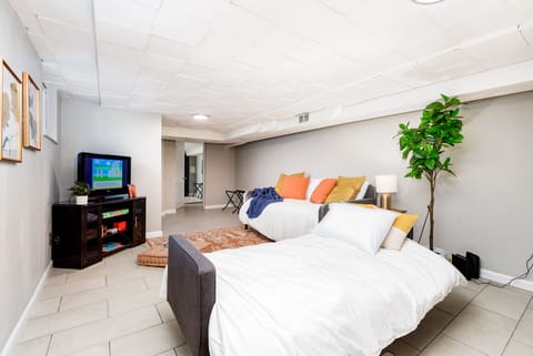 Basement Living Room has a day bed and futon bed.