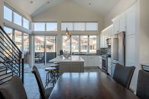 Dining room table with additional seating at the breakfast bar