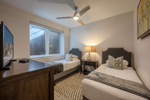 Twin bedroom with hotel-style luxury linens