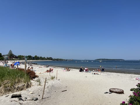 On the beach, sun loungers, beach towels