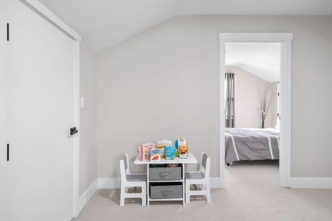 Kids Play area - books, toys, and bean bag chair behind the door 